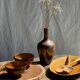 Pair of small orange bowls with black edging