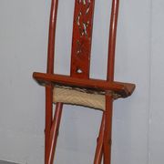 Antique Chinese folding chair with carvings, circa 1900-1920.