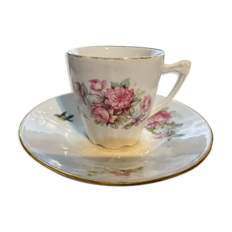 Cup under cup with floral decoration and bird