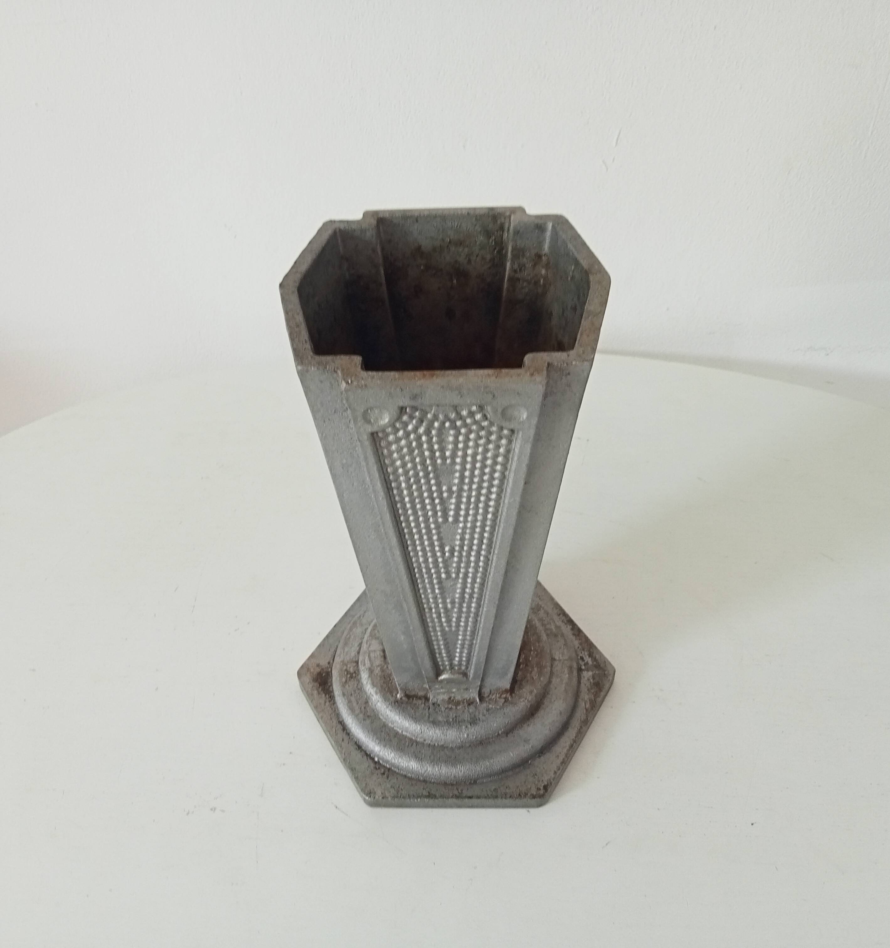 Old art deco vase in cast aluminum