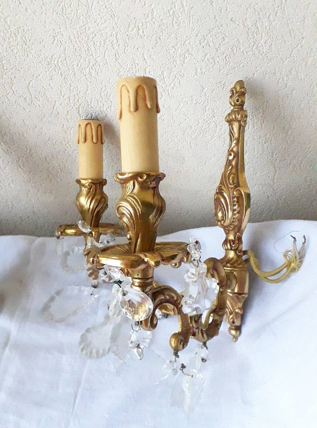pair of bronze wall lights with pendants