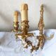 pair of bronze wall lights with pendants