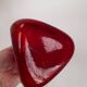 Triangular red glass vase by Gunnar Ander for Elme Glasbrück.