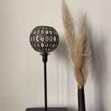 Table lamp with a vintage globe and a black base