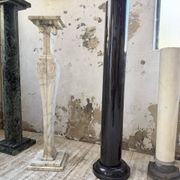 Set of 4 marble columns or pedestals.