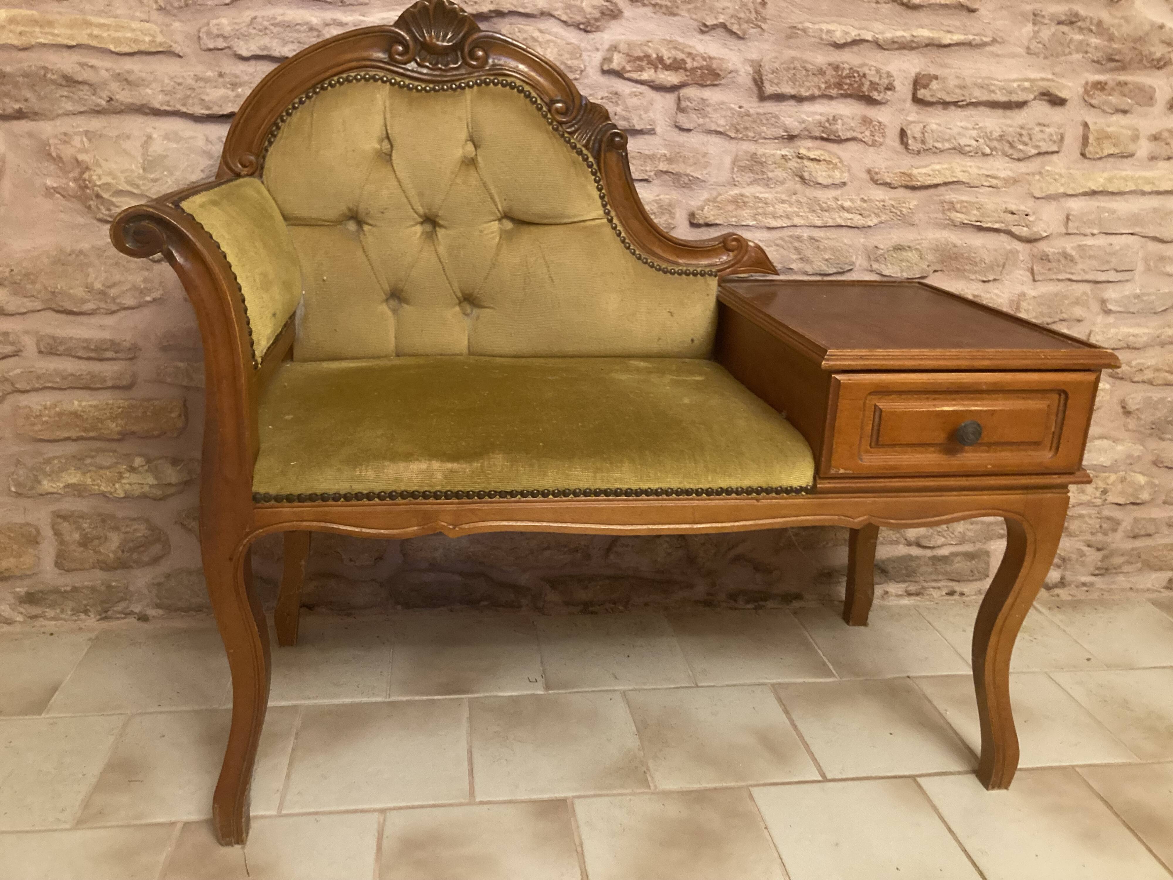 Telephone cabinet with seat