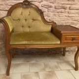 Telephone cabinet with seat