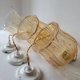 Trio of amber glass pendant lights