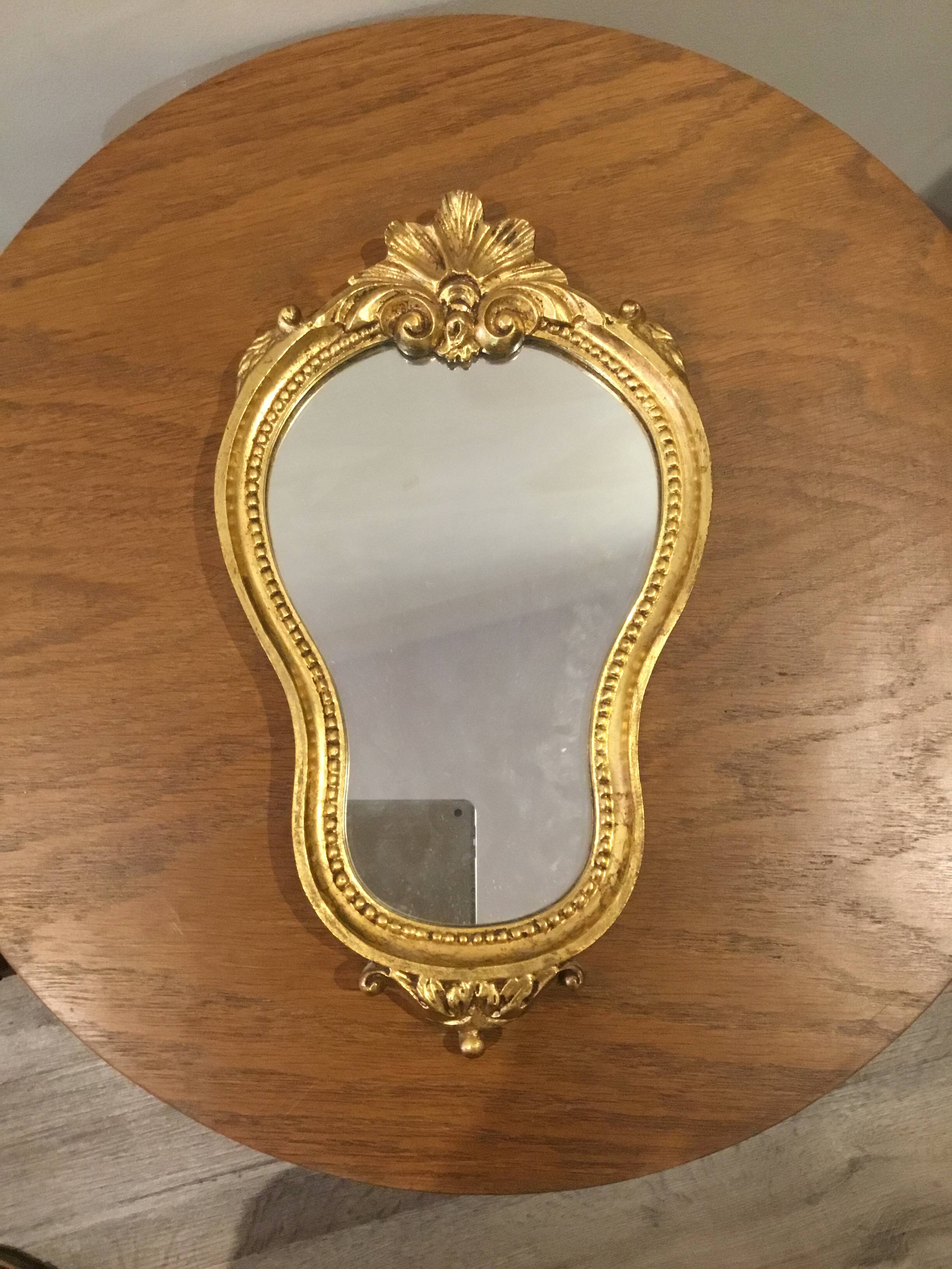 Golden wooden mirror in baroque style
