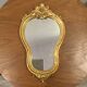 Golden wooden mirror in baroque style