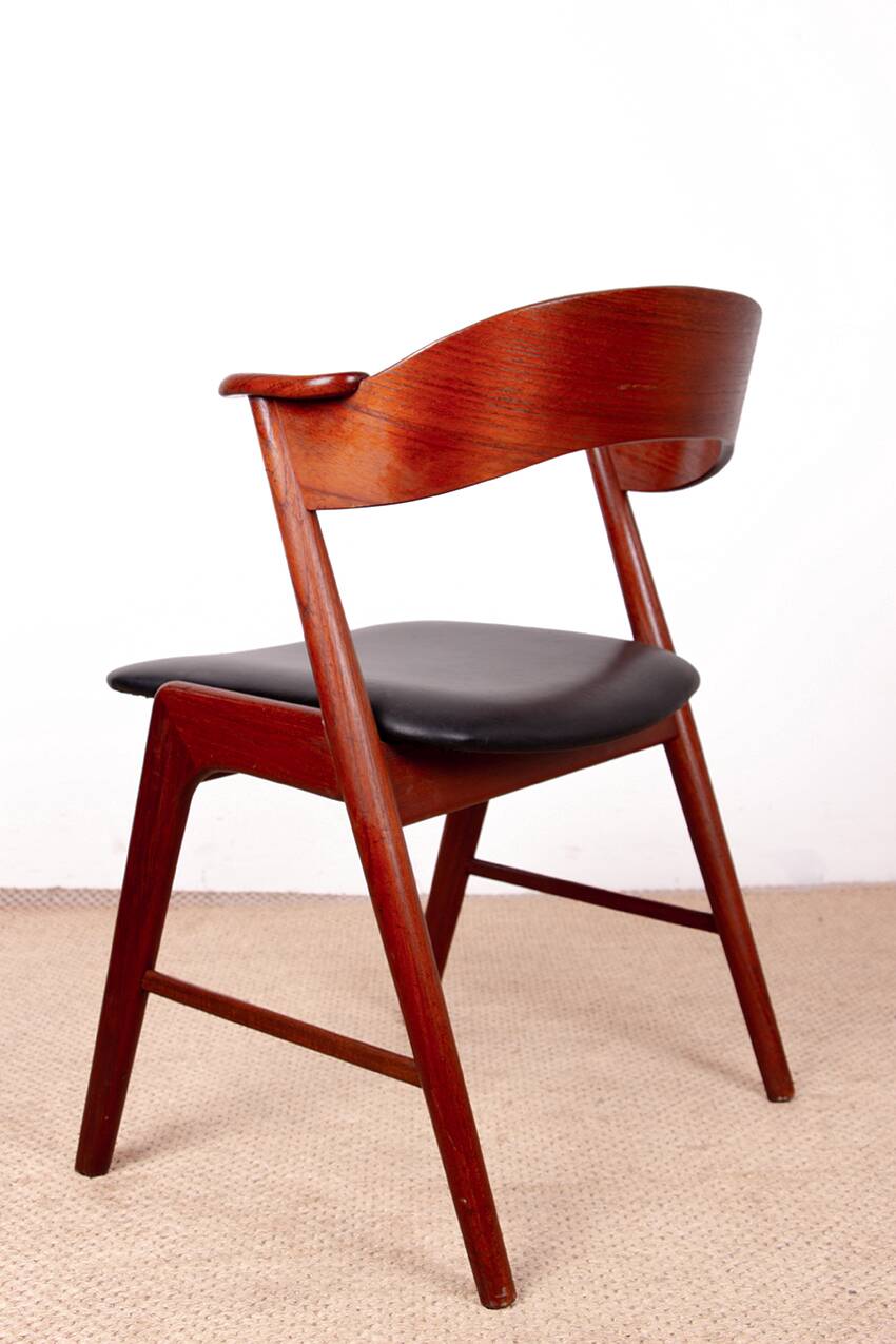 Danish armchair in teak and Skai, by Henning Kjaernulf for Korup Stolefabr.