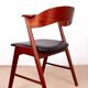 Danish armchair in teak and Skai, by Henning Kjaernulf for Korup Stolefabr.