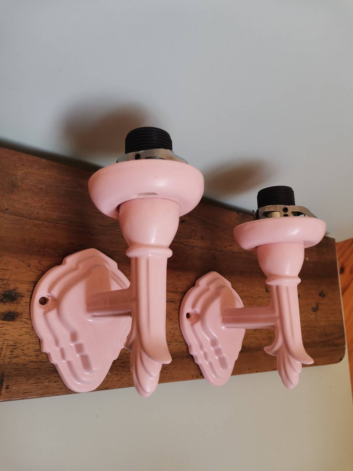 Set of 2 vintage pastel pink enamelled cast iron wall lamps