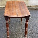 Louis Philippe round table with leaves, solid wood, 19th century, 95cm.