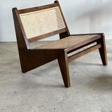 Reclined armchair in canned teak in natural wood