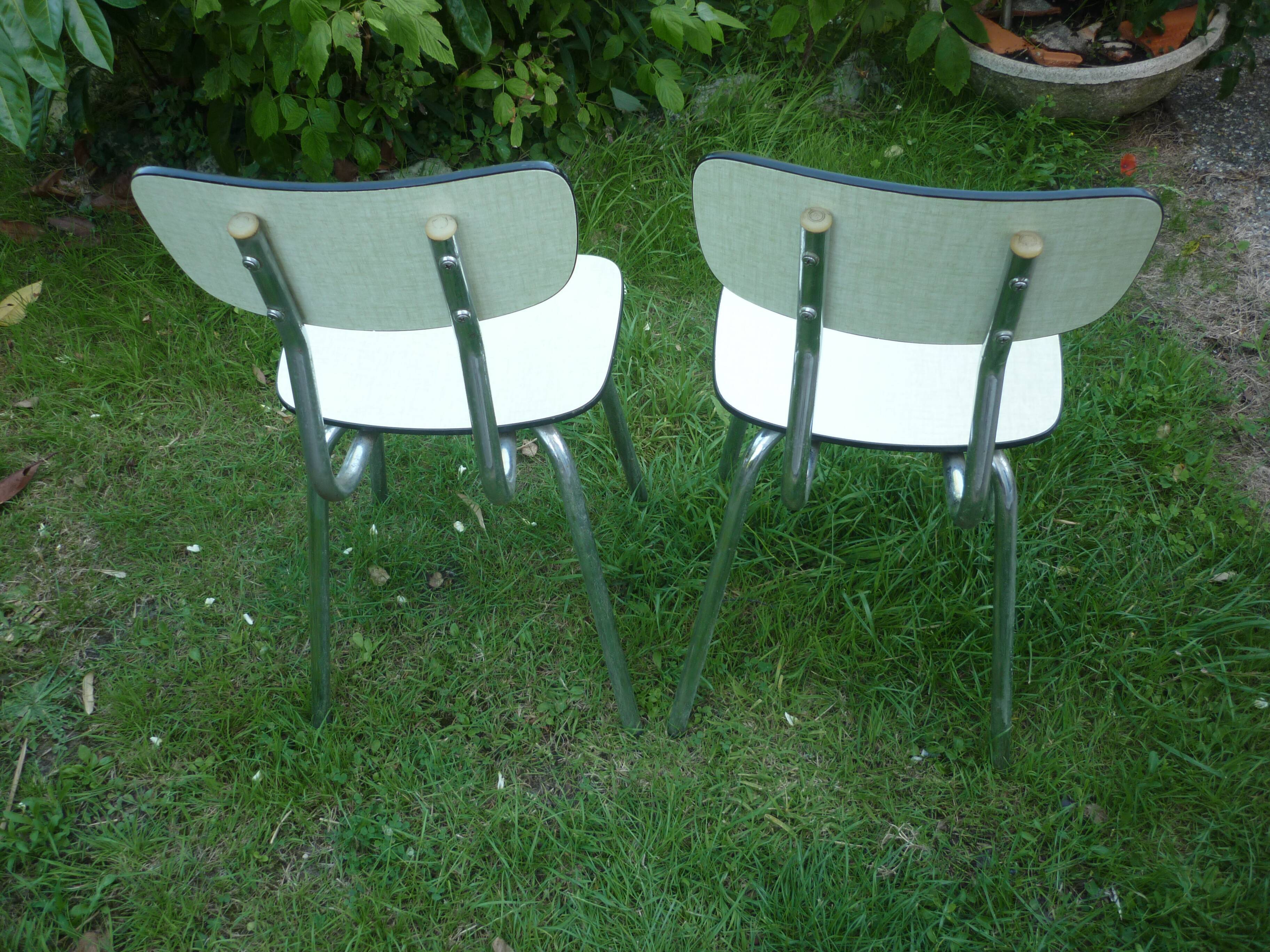 Pair of pale yellow formica chairs