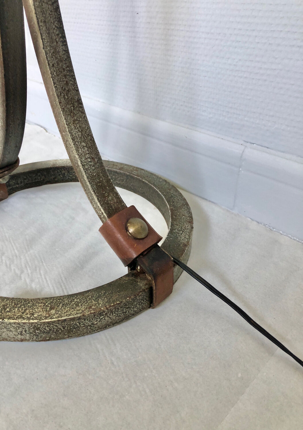 Hammered wrought iron and leather floor lamp by Jean Pierre Rickaert, 1950s