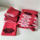 Vintage graphic red tablecloth and 8 matching napkins.