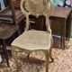 Antique rococo chair in gilded wood and caning