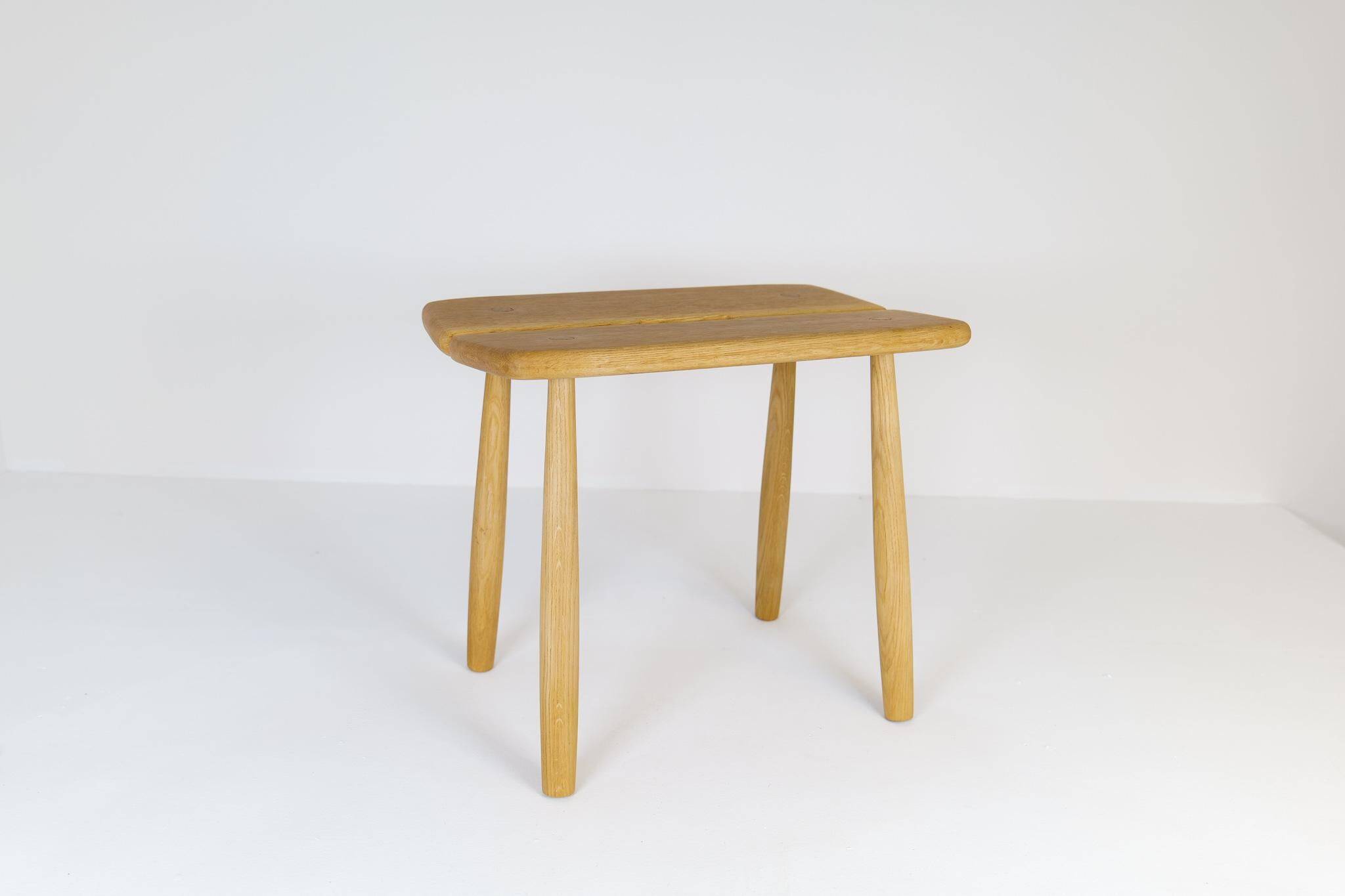 Sculptural mid-century stool in solid oak by Carl Gustaf Boulogner, Sweden, 1950s.