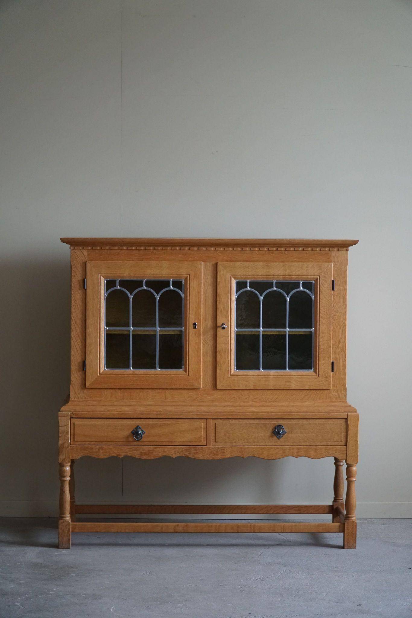 20th-century solid oak display cabinet with a glass front, by a Danish cabinetmaker.
