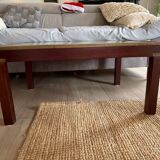 Wood and brass coffee table with a world map under glass.