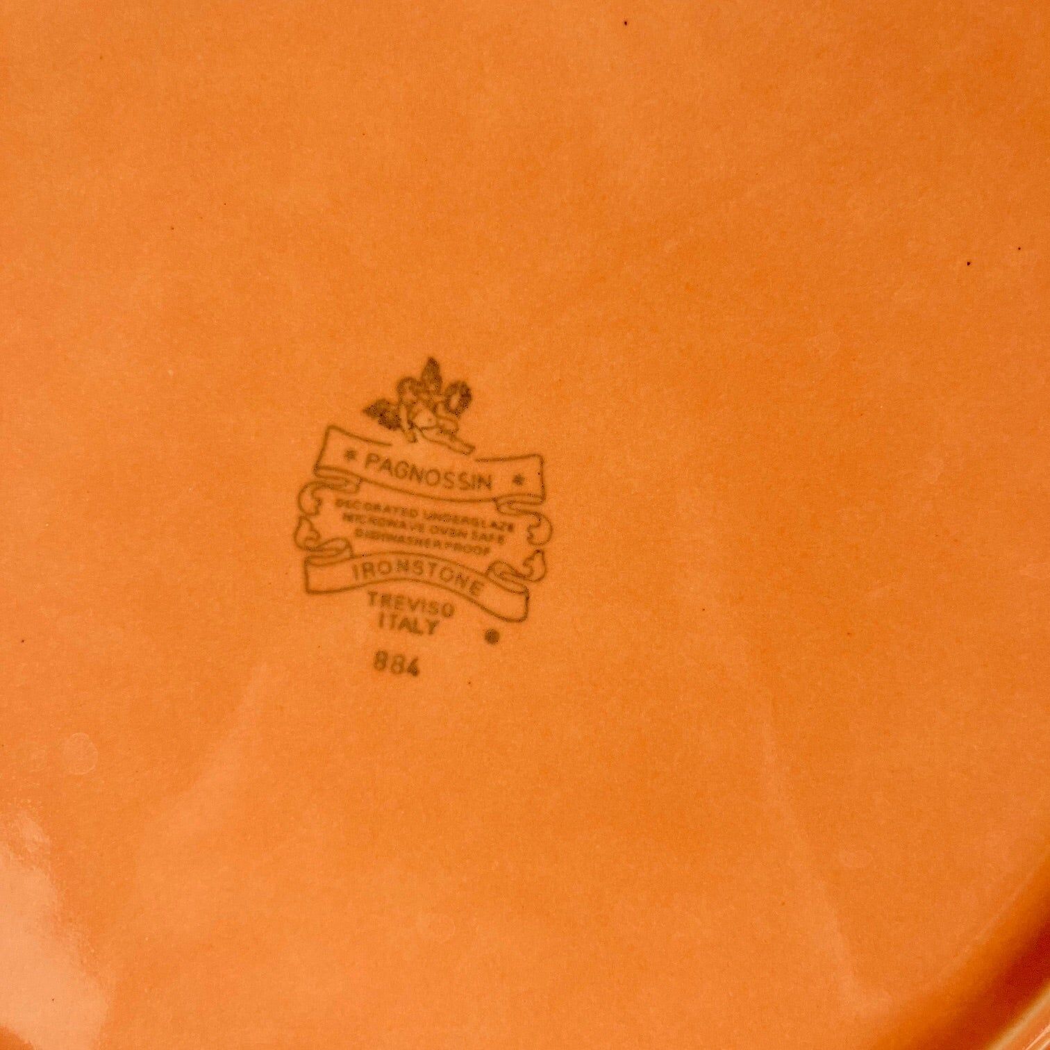 Octagonal plate in salmon pink, iron earth, Pagnossin, Italy, 20th century.