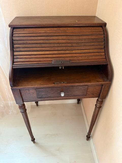 Pretty little secretary with a curtain.