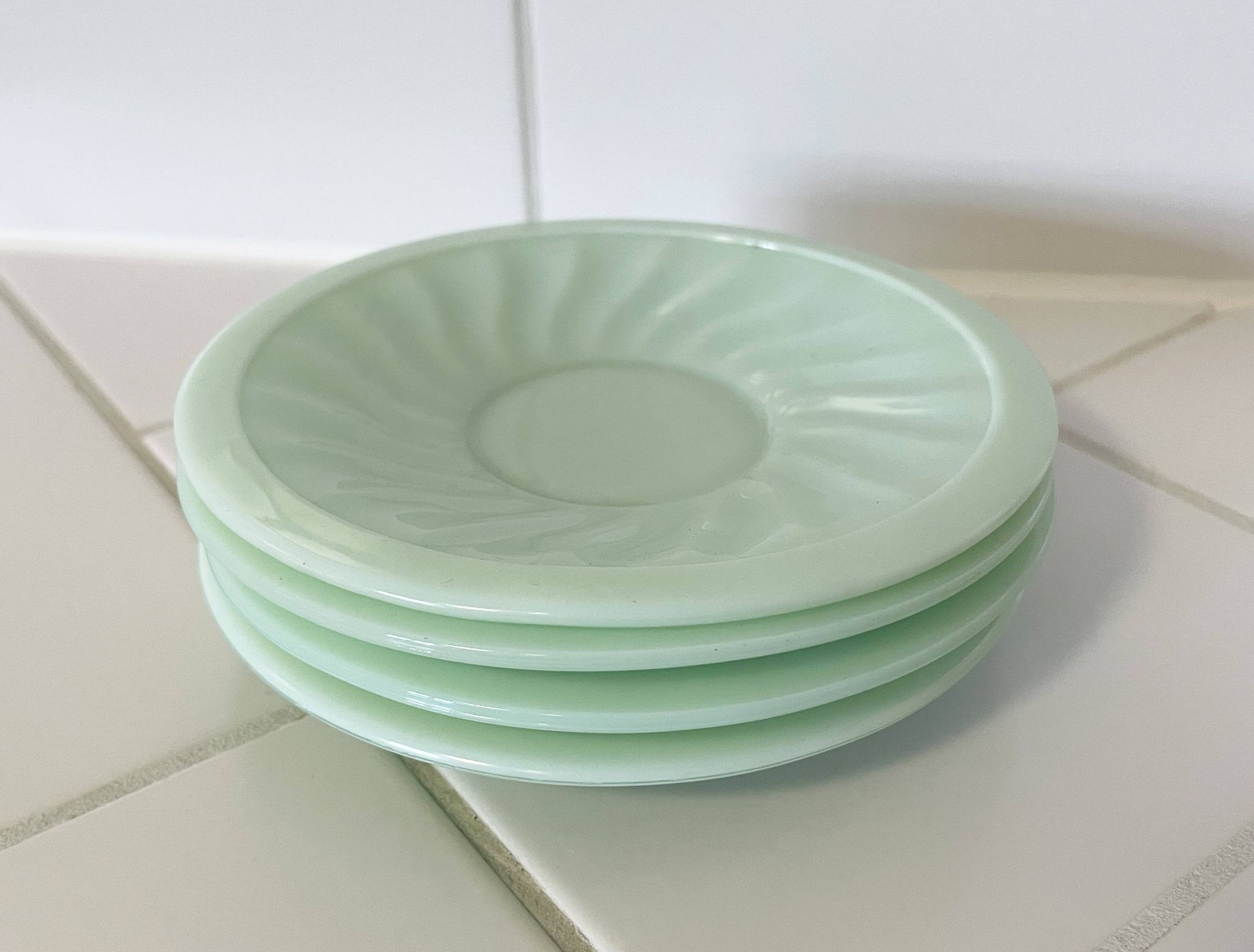 Set of 4 mint green opaline saucers with a swirl pattern, made in France.