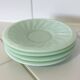 Set of 4 mint green opaline saucers with a swirl pattern, made in France.