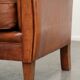 Sturdy vintage sheepskin armchair with a beautiful cognac colour