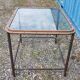 Table with an old ship porthole in brass and a metal base / 100 x 85 x 76 cm