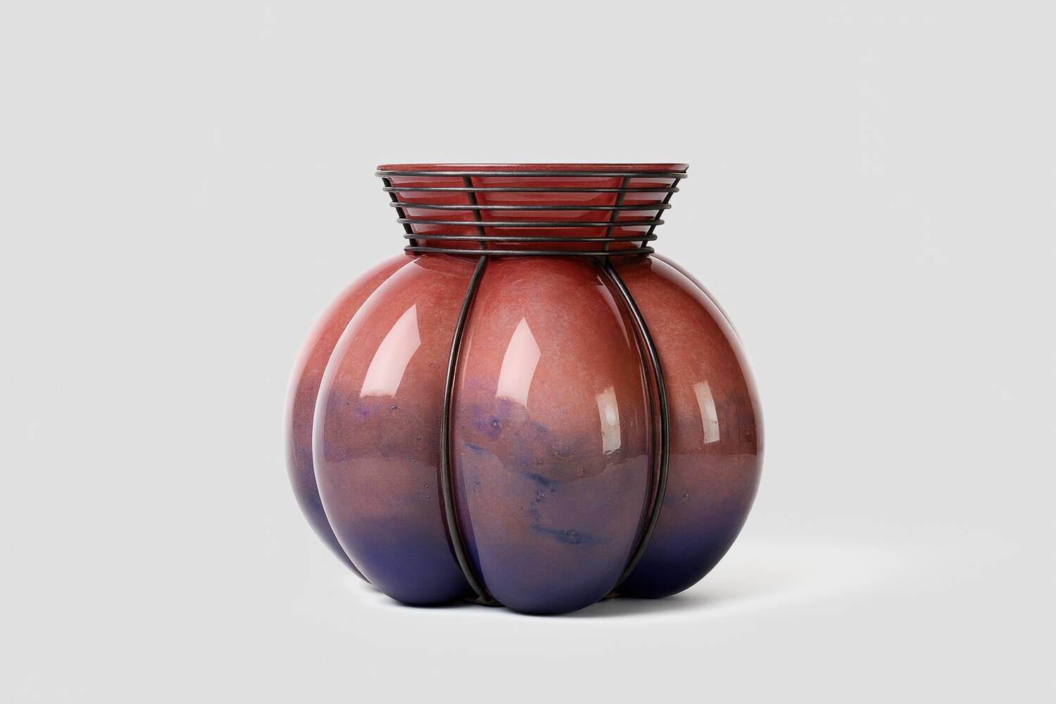 Blown glass vase with metal cage