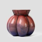 Blown glass vase with metal cage