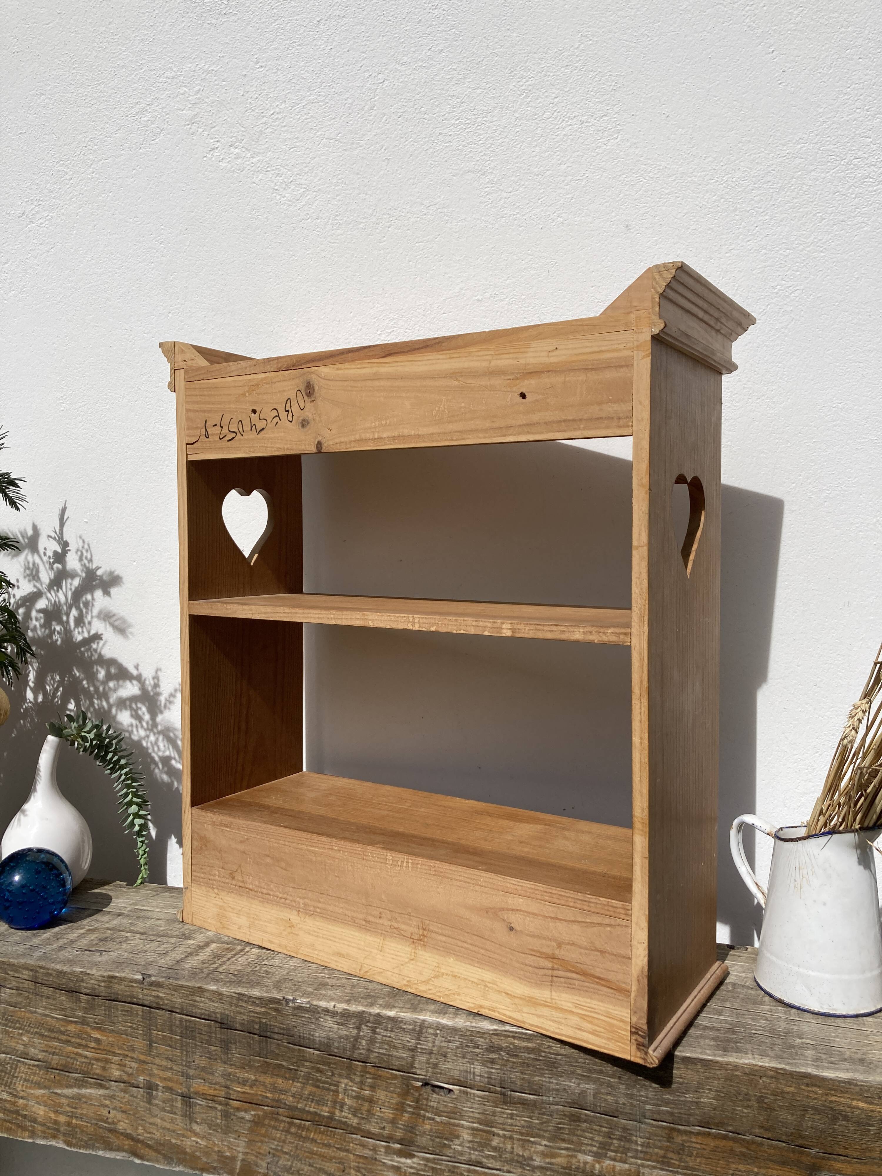 Wall shelf in raw wood with drawers and openwork hearts