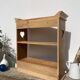 Wall shelf in raw wood with drawers and openwork hearts