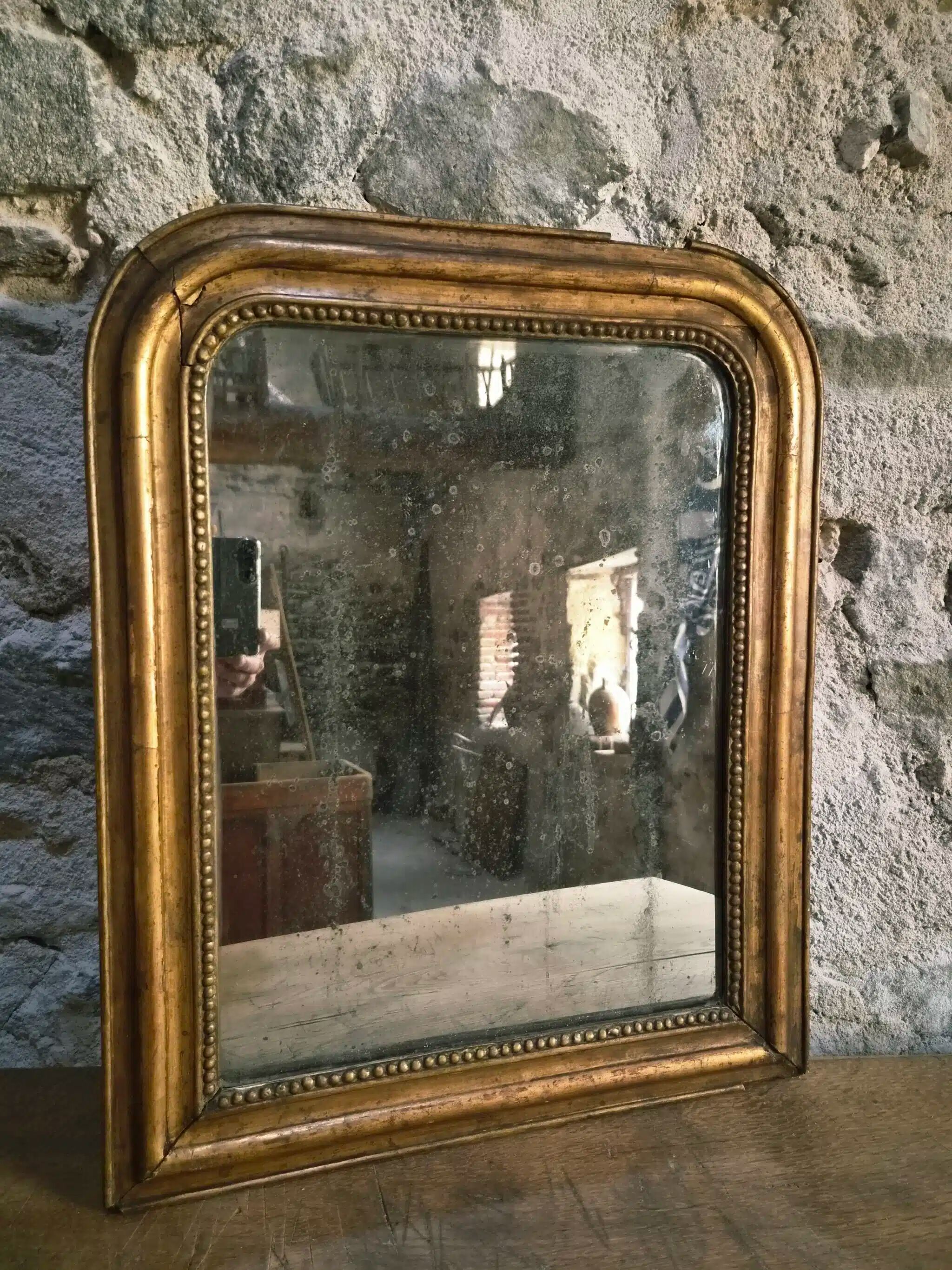 Antique French Louis Philippe mirror, gilded mercury mirror, 19th century.