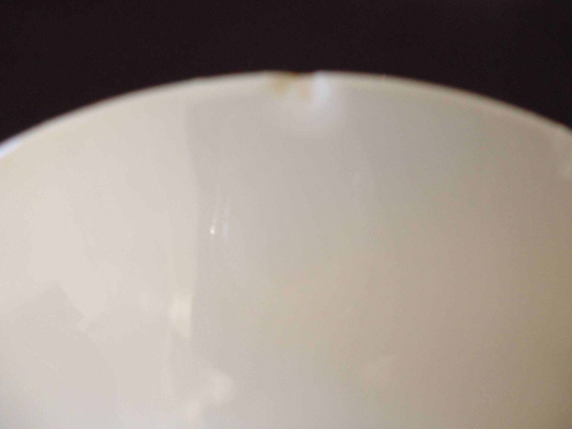 Set of six Art Deco white fine porcelain coffee cups and saucers