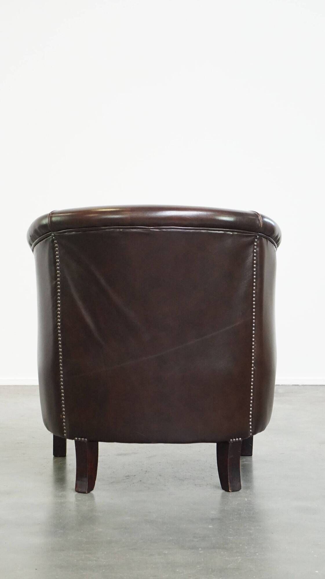 dark cowhide club chair in English style
