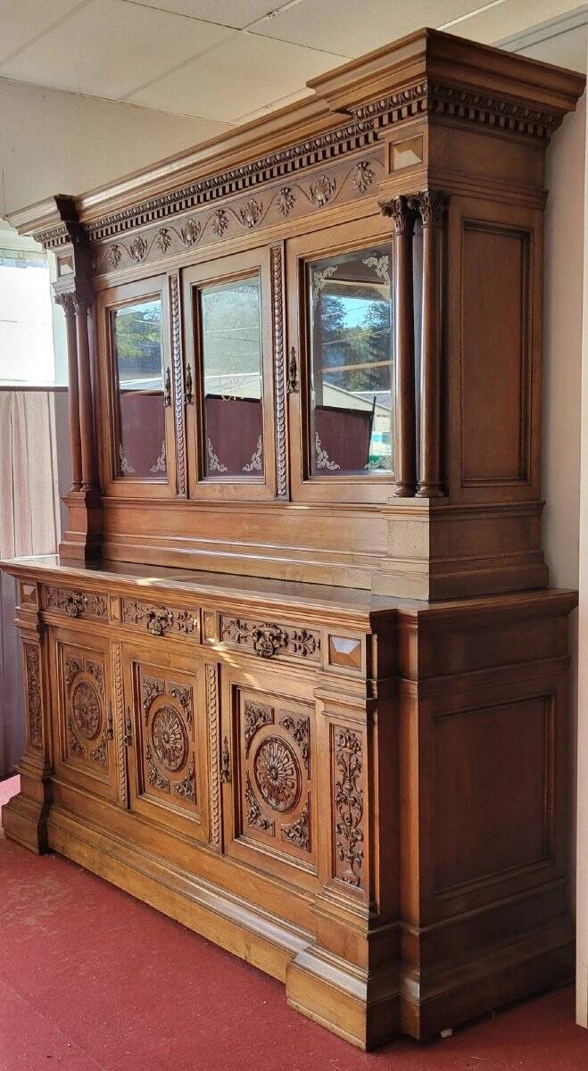 Two-body buffet, made of richly carved solid walnut.