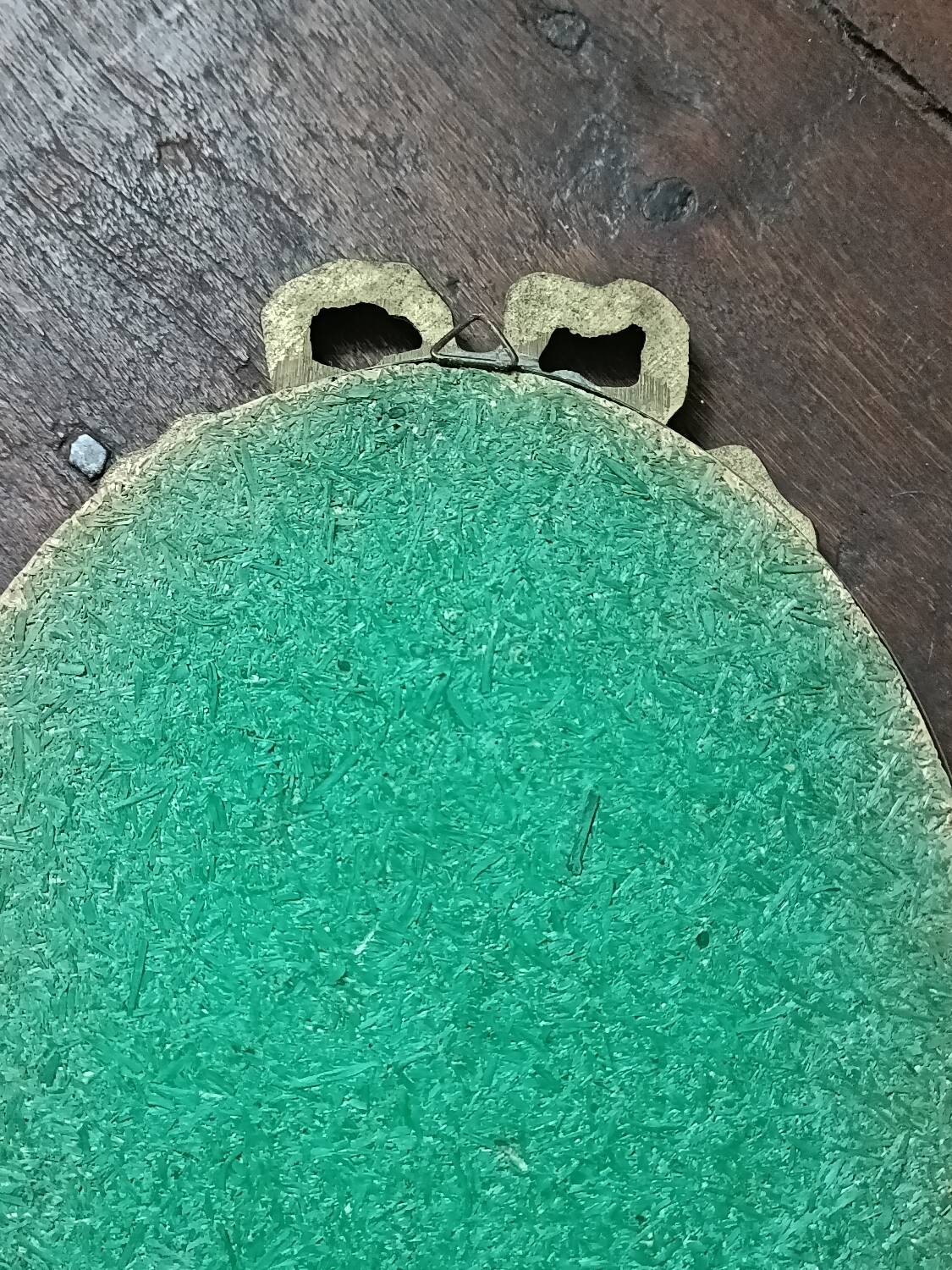 Antique mirror, oval with brass crest