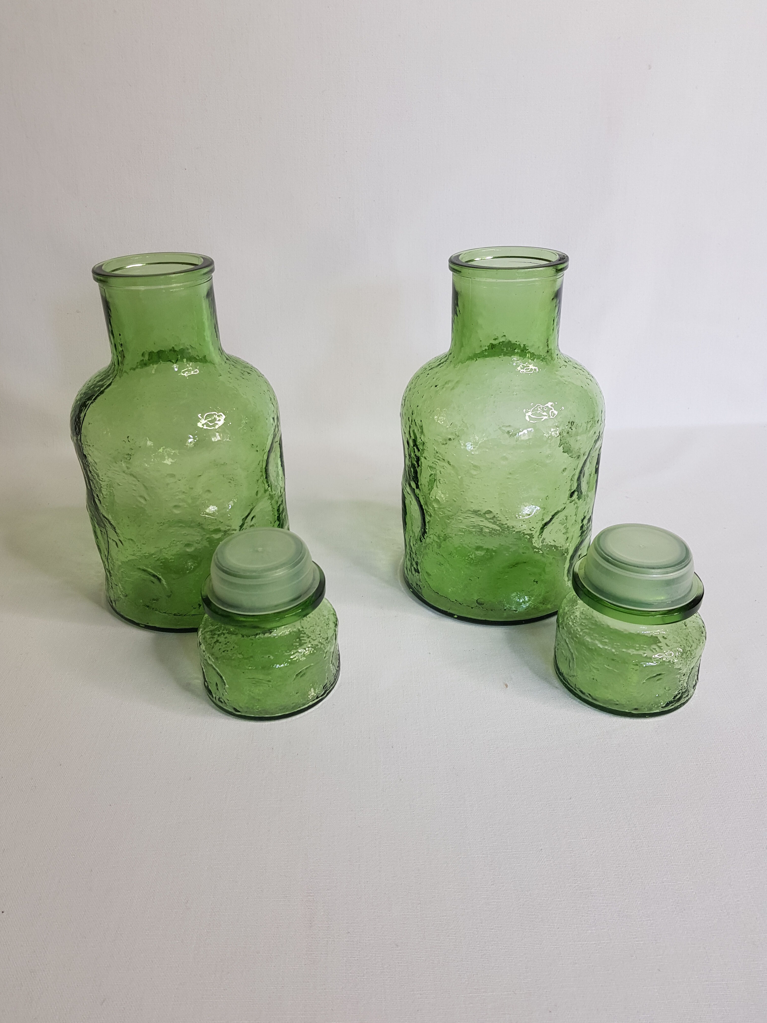 Pair of green moulded glass bottles 70s