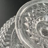 Clear glass footed plate with worked handle