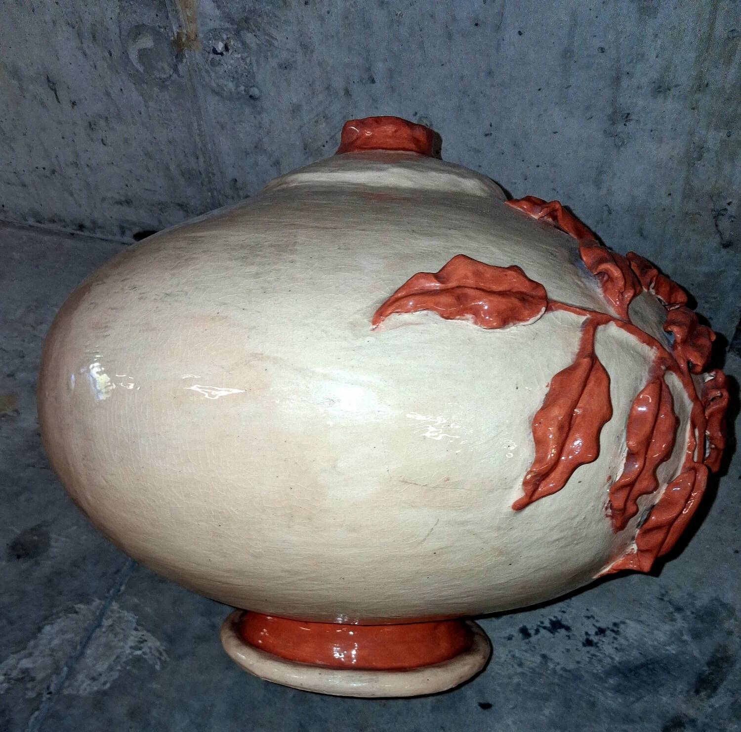 Large vase with relief plant decoration, raw art.