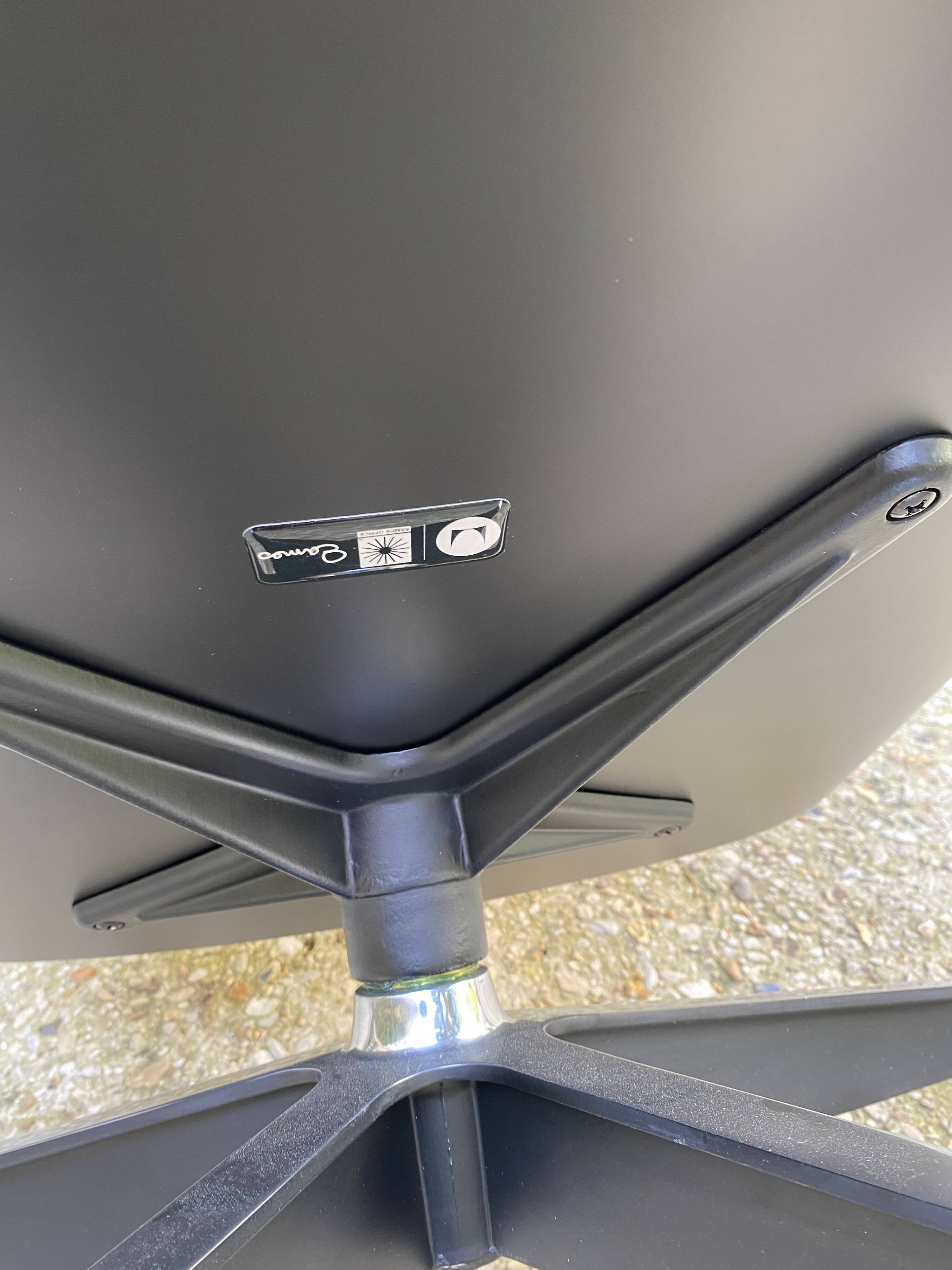 Charles Eames all-black lounge chair and ottoman, Herman Miller edition