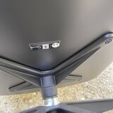 Charles Eames all-black lounge chair and ottoman, Herman Miller edition