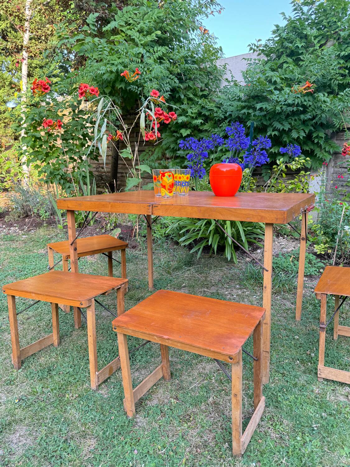 Old suitcase, table and stools, vintage wooden picnic