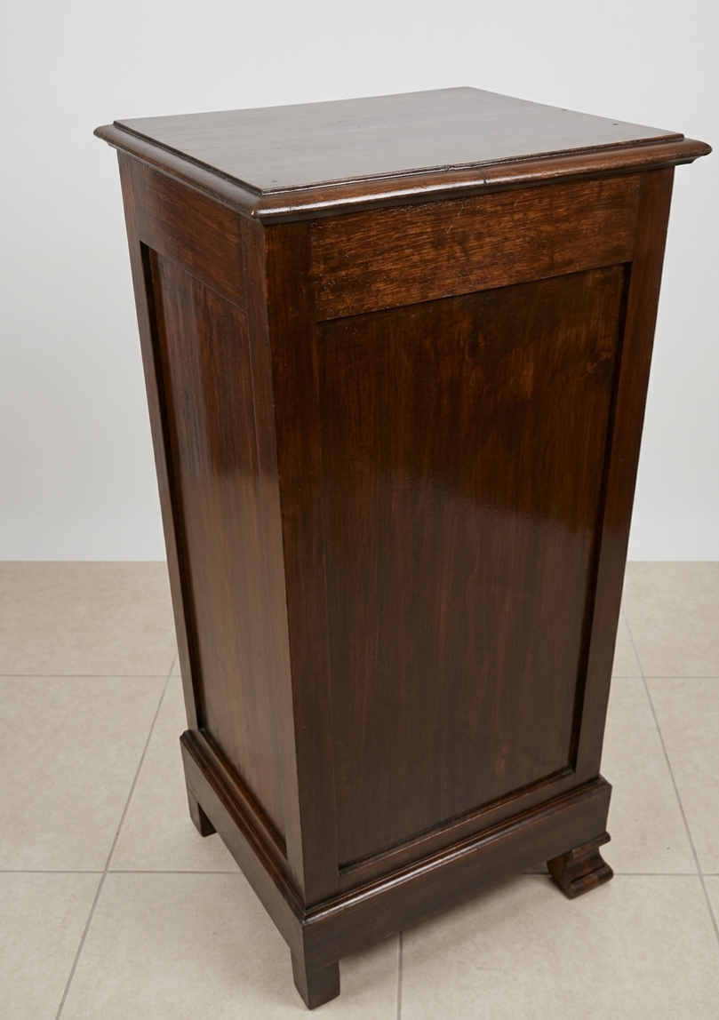 Small storage unit in solid wood and copper.