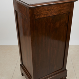 Small storage unit in solid wood and copper.