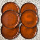 Orange glazed ceramic plates from the 1970s